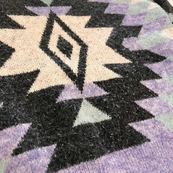 Woman’s purple and black sweater by HyFve