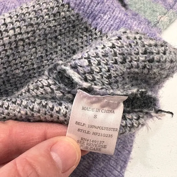 Woman’s purple and black sweater by HyFve