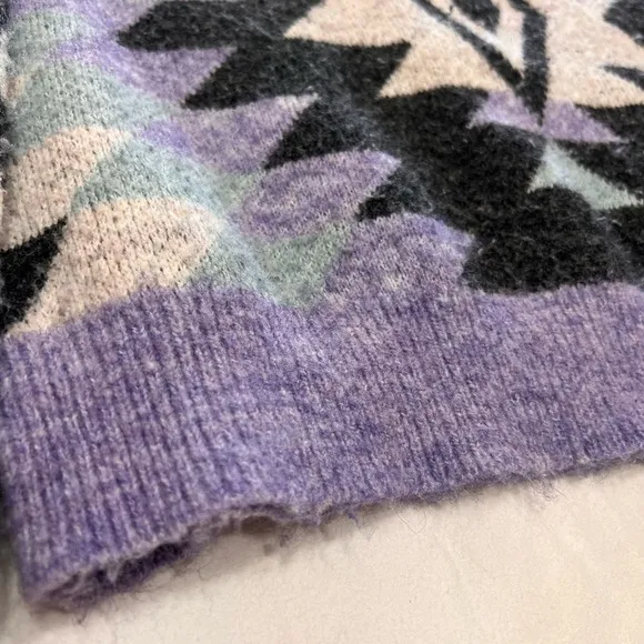 Woman’s purple and black sweater by HyFve